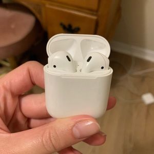 Used AirPods (1st gen) with Coach case